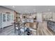 Open-concept kitchen and dining area with a view to living room and stairway at 600 Suncrest Peak Pl, Henderson, NV 89011