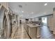 Open living area includes kitchen with island, living room, and dining area at 600 Suncrest Peak Pl, Henderson, NV 89011
