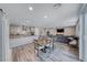 Open-concept living space with kitchen, dining and living area with contemporary design at 600 Suncrest Peak Pl, Henderson, NV 89011
