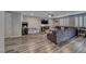 Open living room with wood floors and lots of natural light at 600 Suncrest Peak Pl, Henderson, NV 89011