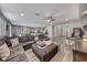 Spacious living room with wood floors, ceiling fan, and open layout at 600 Suncrest Peak Pl, Henderson, NV 89011