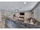 Open living room with wood floors and lots of natural light at 600 Suncrest Peak Pl, Henderson, NV 89011