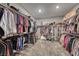 This large walk-in closet features rods and shelving for ample storage of clothes, shoes, and accessories at 600 Suncrest Peak Pl, Henderson, NV 89011