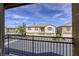 Balcony view of a two-story home with well-maintained landscaping at 6255 W Arby Ave # 118, Las Vegas, NV 89118