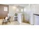 Comfortable hallway nook with chair and plant, leading to other areas of the home at 6255 W Arby Ave # 118, Las Vegas, NV 89118
