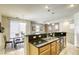 Eat-in kitchen with granite counters, stainless sink, and dining area at 6255 W Arby Ave # 118, Las Vegas, NV 89118