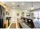 Well-lit kitchen featuring stainless steel appliances and a breakfast bar at 6255 W Arby Ave # 118, Las Vegas, NV 89118
