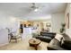 Cozy living room flows into a dining area and kitchen, creating an open and inviting living space at 6255 W Arby Ave # 118, Las Vegas, NV 89118