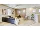Bright open-concept living area with comfortable seating, stylish decor, and abundant natural light at 6255 W Arby Ave # 118, Las Vegas, NV 89118