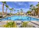 Stunning community pool with palm trees and lounge chairs, perfect for relaxation and enjoyment at 6255 W Arby Ave # 118, Las Vegas, NV 89118