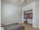 Inviting bedroom with modern accent wall, light floors and walk-in closet at 6329 Sterling Ranch Way, North Las Vegas, NV 89081