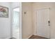 Bright entryway with wood floors, a coat hook, and art on the wall at 6329 Sterling Ranch Way, North Las Vegas, NV 89081