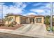 Charming single-story home with a well-maintained front yard and a spacious driveway on a sunny day at 6329 Sterling Ranch Way, North Las Vegas, NV 89081