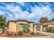 Attractive single-story home with manicured front yard, showcasing curb appeal and a welcoming facade at 6329 Sterling Ranch Way, North Las Vegas, NV 89081