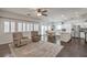 Open living room and kitchen area with hardwood floors, recessed lighting, and neutral paint at 6329 Sterling Ranch Way, North Las Vegas, NV 89081