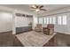 Inviting living room features hardwood floors and neutral paint, with built-in storage at 6329 Sterling Ranch Way, North Las Vegas, NV 89081