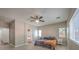 Bright main bedroom with fan and light and an ensuite bath at 6329 Sterling Ranch Way, North Las Vegas, NV 89081
