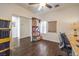 Neutral office with hardwood floors, ceiling fan and ample storage with natural light at 6329 Sterling Ranch Way, North Las Vegas, NV 89081