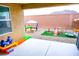 This backyard space has an outdoor patio area and a fun playground for  at 645 Turtleback Falls Ave, Indian Springs, NV 89018