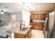 Modern kitchen with granite countertops, stainless steel appliances, and pendant lighting over the island at 645 Turtleback Falls Ave, Indian Springs, NV 89018