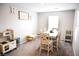 Bright playroom with a large table and chairs, perfect for arts and crafts at 645 Turtleback Falls Ave, Indian Springs, NV 89018