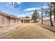 Large backyard featuring a covered patio and ample open space, great for customization at 6582 Cartgate Ct, Las Vegas, NV 89110