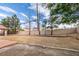 Expansive backyard with ample space, a covered patio, and mature landscaping at 6582 Cartgate Ct, Las Vegas, NV 89110