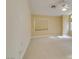 Bright bedroom with neutral carpet, ceiling fan, and large windows, offering ample natural light at 6582 Cartgate Ct, Las Vegas, NV 89110