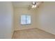Bedroom features neutral walls, carpet flooring, natural light, and a ceiling fan at 6582 Cartgate Ct, Las Vegas, NV 89110