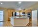 Bright kitchen features stainless appliances, granite countertops, and a central island at 6582 Cartgate Ct, Las Vegas, NV 89110