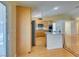 Open kitchen features wood cabinets, stainless appliances, granite counters and breakfast bar at 6582 Cartgate Ct, Las Vegas, NV 89110