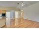 Open floor plan combining the living room and kitchen areas with vaulted ceiling at 6582 Cartgate Ct, Las Vegas, NV 89110