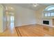 Bright living room featuring a fireplace, and hardwood flooring at 6582 Cartgate Ct, Las Vegas, NV 89110