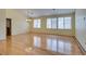 Bright living room with wood floors, recessed lights, chandelier, and window shutters at 6582 Cartgate Ct, Las Vegas, NV 89110