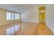 Sunlit living room with gleaming hardwood floors and plantation shutters at 6582 Cartgate Ct, Las Vegas, NV 89110