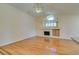 Inviting living room featuring a fireplace, vaulted ceilings, and hardwood floors at 6582 Cartgate Ct, Las Vegas, NV 89110