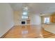 Spacious living room featuring a fireplace, vaulted ceilings, and hardwood flooring at 6582 Cartgate Ct, Las Vegas, NV 89110