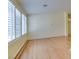 Bright living room with vaulted ceiling, wood floors, and window shutters at 6582 Cartgate Ct, Las Vegas, NV 89110