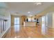 Open-concept living area with a fireplace, a kitchen island, and sliding glass doors at 6582 Cartgate Ct, Las Vegas, NV 89110