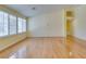 Bright living room with wood floors and window shutters at 6582 Cartgate Ct, Las Vegas, NV 89110