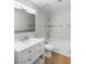 Bright bathroom with white vanity and tiled shower-tub at 6733 W Charleston Blvd # 3, Las Vegas, NV 89146