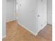 This hallway features neutral walls, interior doors, and tile floors at 6733 W Charleston Blvd # 3, Las Vegas, NV 89146