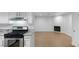 Open layout with kitchen and living space offers a versatile area, complete with a modern fireplace at 6733 W Charleston Blvd # 3, Las Vegas, NV 89146