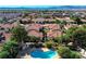 Aerial view of the neighborhood pool and hot tub surrounded by well-maintained landscaping and homes at 6733 W Charleston Blvd # 3, Las Vegas, NV 89146