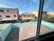 An aerial view of the backyard featuring a brick-paved patio and block wall at 6778 Goose Watch Ct, Las Vegas, NV 89139