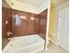 Bathroom boasts a luxurious bathtub with stylish tile surround and modern fixtures at 6778 Goose Watch Ct, Las Vegas, NV 89139