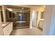 Bathroom featuring a large glass shower and double vanity at 6778 Goose Watch Ct, Las Vegas, NV 89139