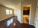 Bedroom connects to an ensuite bathroom, featuring hardwood floors and natural light at 6778 Goose Watch Ct, Las Vegas, NV 89139