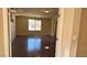 Light-filled bedroom featuring a tray ceiling, wood floors, and plenty of space at 6778 Goose Watch Ct, Las Vegas, NV 89139