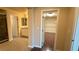 Hallway leading to a bathroom, bedroom, and walk-in closet at 6778 Goose Watch Ct, Las Vegas, NV 89139